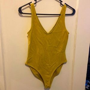 Mustard snap bottom bodysuit.